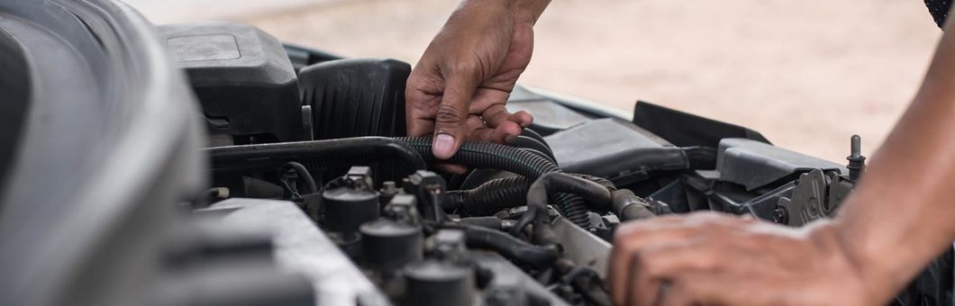 Man repairs car